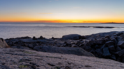 Sunset on skerries in Ytre Hvaler National Park, on the island of Kirkeoy in Norway