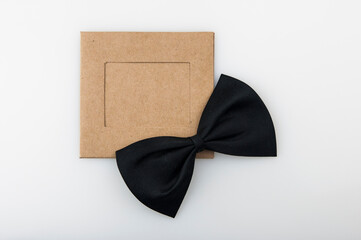 Picture frame and a bow tie on white background