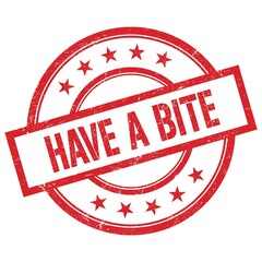 HAVE A BITE text written on red vintage round stamp.