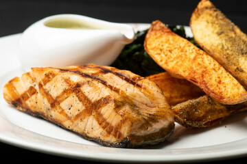 Grilled Salmon with Spinach and wedges.