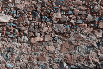Stone wall of an old house in a village
