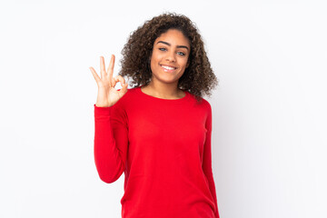 Young African American woman isolated on background showing ok sign with fingers