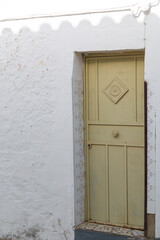 Door of a rustic house in a village
