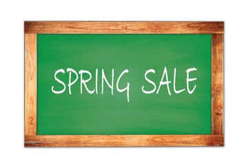 SPRING  SALE text written on green school board.