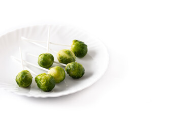 Set of brussel sprouts with lollipop sticks isolated on white background.Copy space