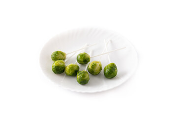 Set of brussel sprouts with lollipop sticks isolated on white background