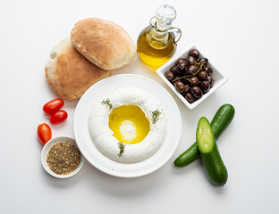 Lebanese food of Labneh Yogurt cheese with Olives and veggies.