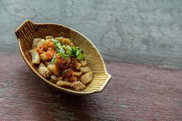 Pork Crackling from lard or Stir-Fried Pork Crackle seasoning with spicy-sweet dipping sauce in...