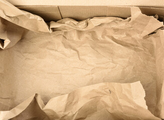 open empty rectangular brown cardboard box for transportation and packaging of goods