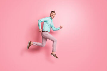 Fototapeta na wymiar Full body profile side photo of attractive man happy shopping run empty space jump up isolated on pink color background