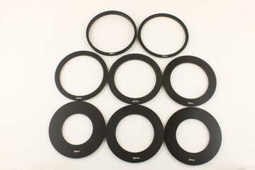 Selection of different size camera lens adaptor rings - Powered by Adobe