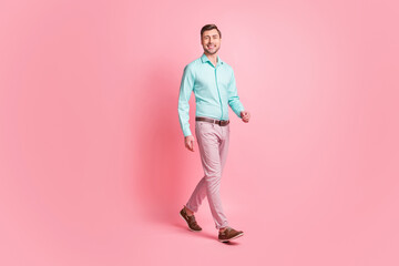 Full length body size photo of entrepreneur in formal wear stepping forward smiling isolated on pastel pink color background