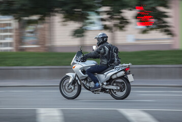 Obraz na płótnie Canvas motorcyclist on a motorcycle moves