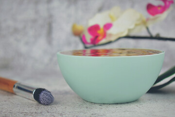 Bowl with chocolate to apply on the skin. Spa, care and health. 