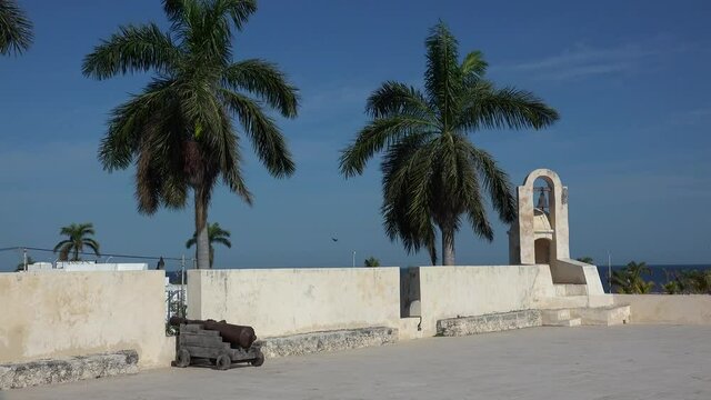 Second level of the Bastion of San Carlos with guns and bell tower. San Francisco de Campeche, Mexico