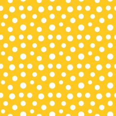 Tapeten Yellow dotted seamless pattern. White dots on yellow background. Vector illustration. © Studio Barcelona
