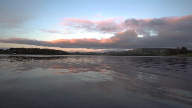 Calm lake in blessington ireland sunset hour golden hour
