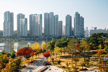View of modern skyscrapers and Gwanggyo Lake Park at autumn in Suwon, Korea