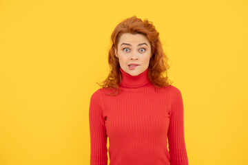 shocked red haired woman. surprised redhead woman on yellow background.