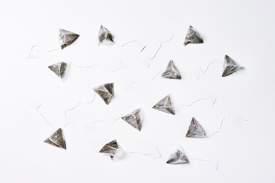 A Group Of Tea Bags On White Background