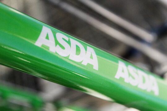 Bletchley, Buckinghamshire / UK - February 2, 2019: Close up of ASDA logo on shopping cart.
