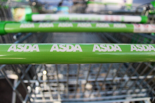 Bletchley, Buckinghamshire / UK - February 2, 2019: Close up of ASDA logo on shopping cart.