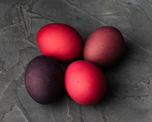 colored chicken eggs on a dark background. Easter eggs. Place for an inscription