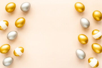 Flat lay of golden and silver eggs. Good luck symbol. Easter decoration