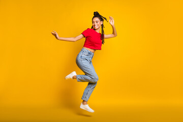 Fototapeta na wymiar Full length body size profile side view of lovely skinny cheerful girl jumping dancing isolated on bright yellow color background