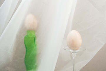 Vintage still life with two eggs and a green vase. The concept of the Easter holiday.