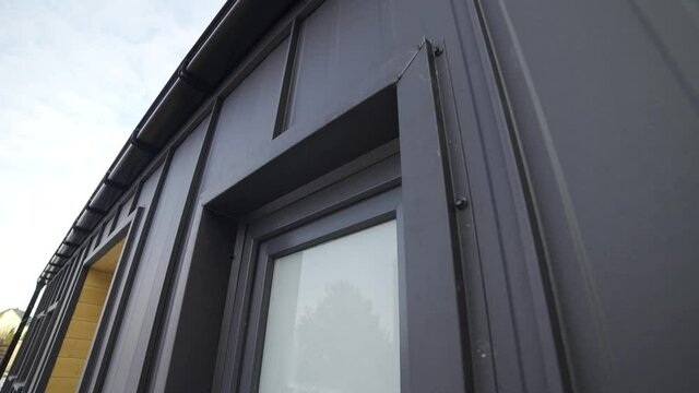 exterior of a frame house under construction.