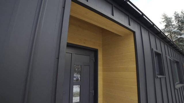 exterior of a frame house under construction.