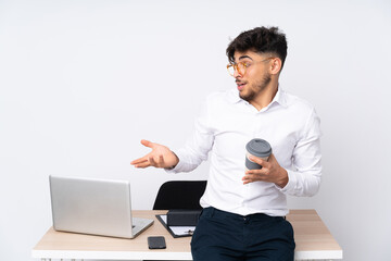 Arabian man in a office isolated on white background with surprise facial expression