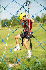 Active boy in climbering park