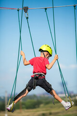 Active boy in climbering park