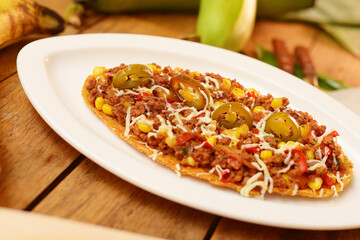 patacon, typical Colombian food, patacon with chicken and cheese