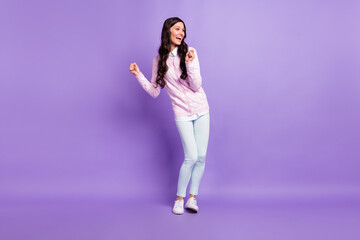 Fototapeta na wymiar Full length body size view of attractive cheerful wavy-haired girl dancing having fun isolated on violet color background