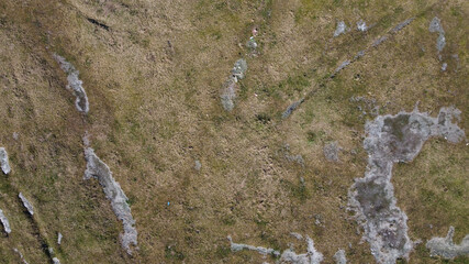 Patches of ice on field.