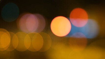 Abstract background of city lights bokeh. Blurred city lights . Defocused blurred lights. City at night . Traffic light. Traffic light bokeh. City bokeh night light .