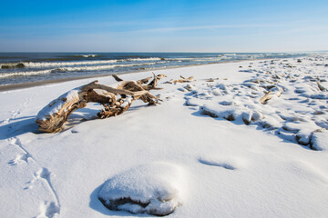 Snow on the beach and the frozen Baltic Sea. Beautiful winter landscape 