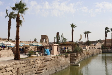 Karnak temple in historic city. Ruins of the ancient town. View of the antique famous sculptures at the Karnak Temple in Luxor, Egypt. Travel to African continent. UNESCO World Heritage Site.