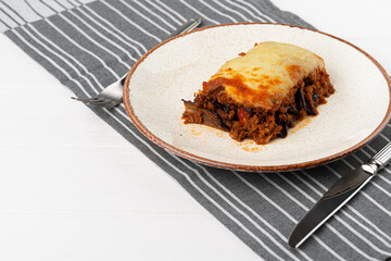 Piece of fresh meat lasagna with cheese