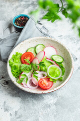 healthy vegetable salad tomato, cucumber, radish mix lettuce portion on the table meal snack copy space food background rustic image diet vegan or vegetarian food