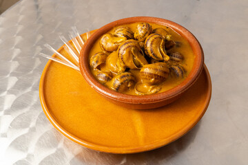 Snails with sauce.
