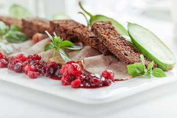 Sliced Beef or Pork with Marinated Vegetables and Sauce. Beautifully decorated catering banquet menu. Food snacks and appetizers for buffet on white background