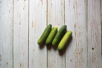 Top view of fresh cucumbers on a background with use of selective focus.