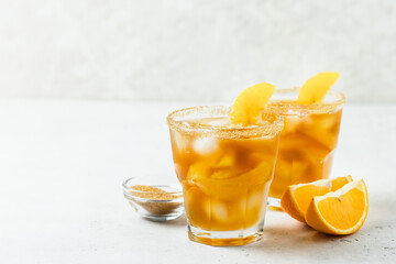 Honey citrus  iced tea, summer festive drink in glasses. Space for text.