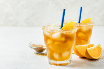 Honey orange iced green tea,  summer cold cocktails in glasses. Space for text.