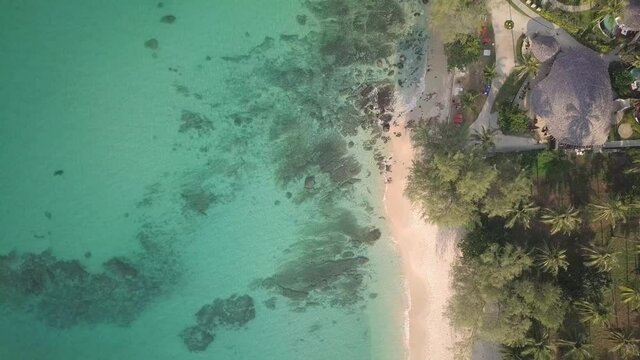 Aerial View Of Beautiful Tropical Beach In Koh Kood Island In Thailand With Turquoise Blue Sea On A Sunny Summer Day. top-down drone shot