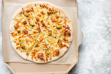 pizza seafood mussels, squid, shrimps prawn portion on the table cooking meal snack outdoor top view copy space for text food background